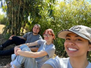 Three students smiling in Guatemala.