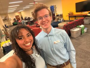 Two smiling students dressed up for UMW's Celebration of Giving.