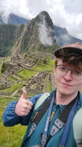 A photo of a student in front of Machu Picchu.