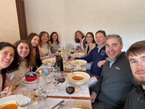 A group of UMW students and two administrators at a restaurant in Spain.