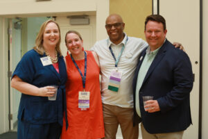 Katie Turcotte and Mark Thaden with an alumni couple.