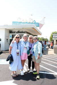 Four alumnae pose in front of Carl's after enjoying frozen custard.