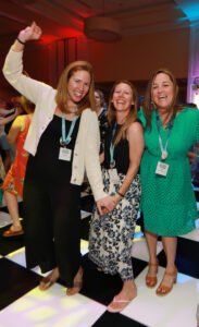 Three alumnae dancing at the all-class party during Reunion Weekend.