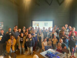A photo of a large group of alumni at a brewery in Richmond.