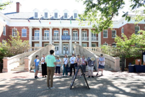Alumni in front of Lee Hall during a student-led tour of campus.