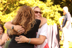 Two alumnae hug during Reunion Weekend.