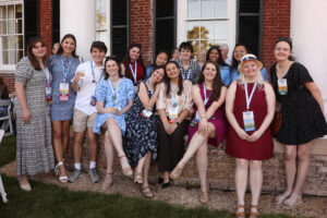 A group of young alumni, students, and staff at Brompton.