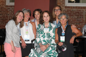 1986 alumnae pose for a photo in the Underground.