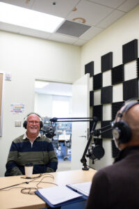 A professor being interviewed by President Paino in the HCC podcast studio.
